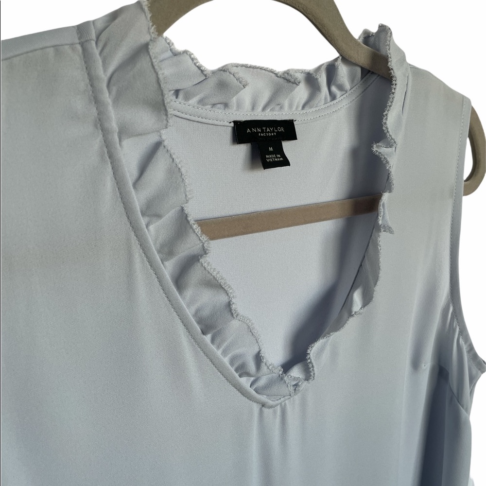 Bought NWOT worn once. Ann Taylor pale blue ruffle v-neck sleeveless blouse M